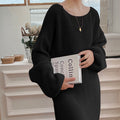 A Knee-length Knitted Sweater Dress Creates A Refined And Elegant Look For The Modern Woman